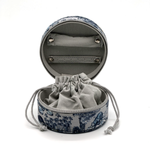 Open blue world map print jewelry box with ring holders and drawstring pouch
